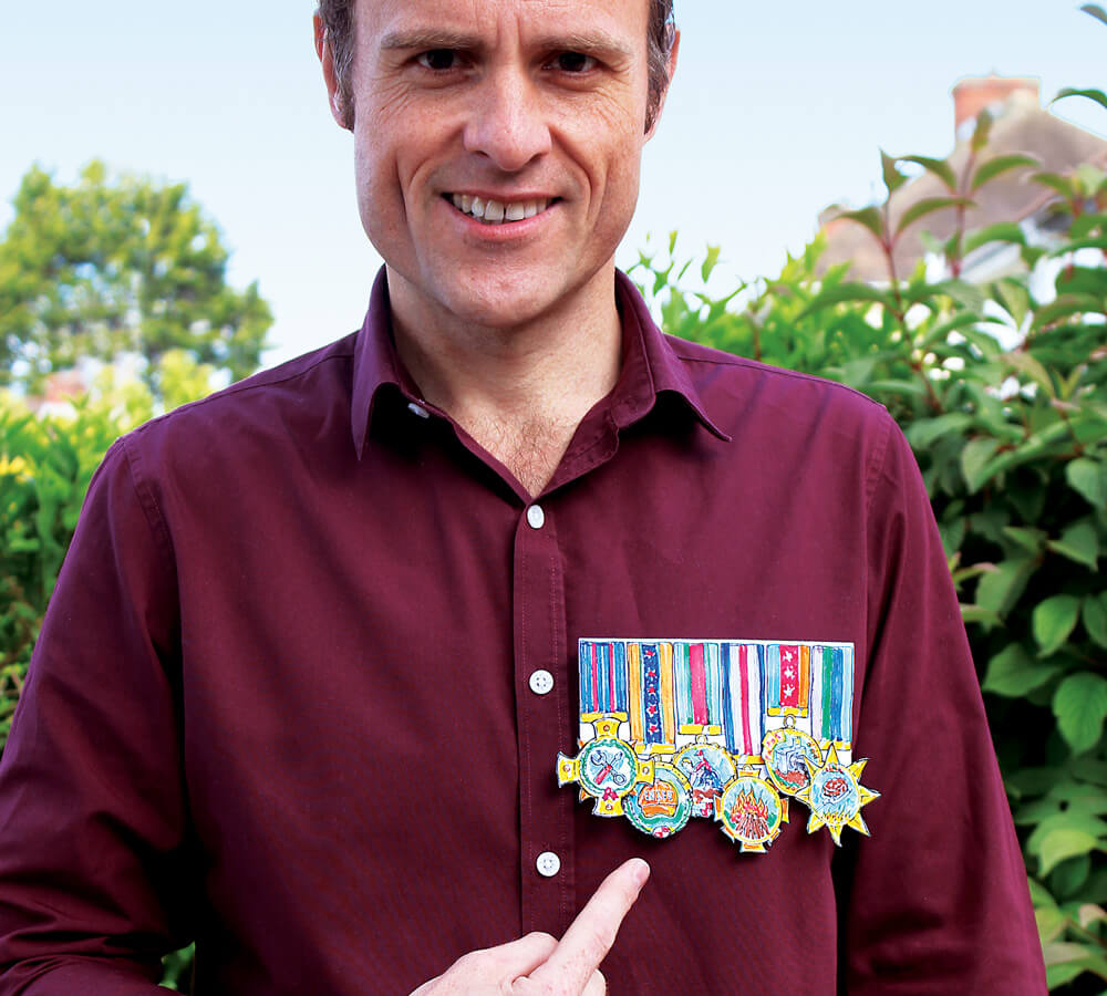 Dad wearing a 'My Hero' Father's Day card medal set on his chest